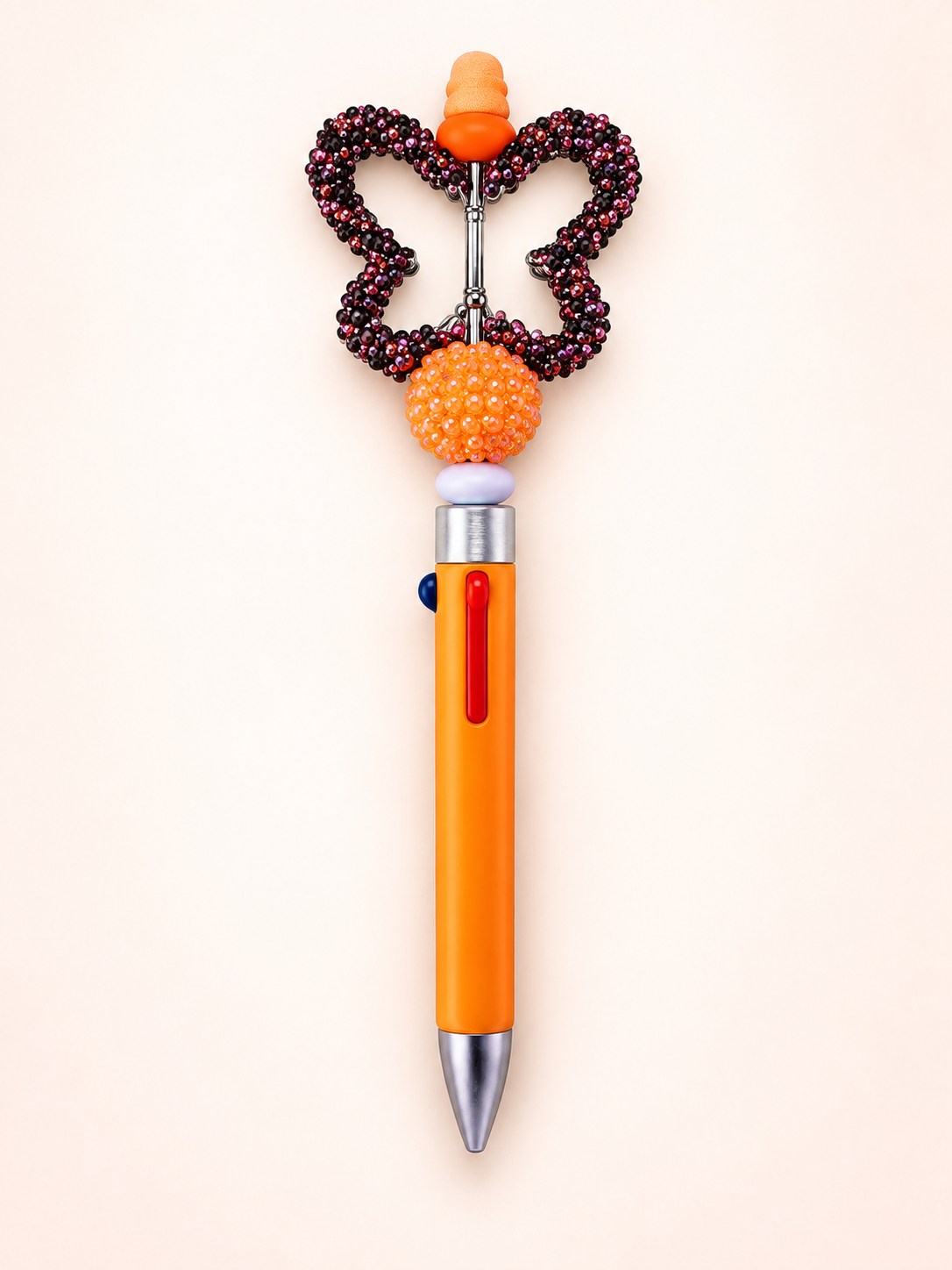 Orange multi-ink handmade pen with a rhinestone butterfly topper